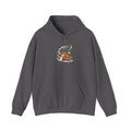 Charcoal Gildan 18500 pullover hoodie with a fox curled beside a lantern on a snowy pine branch, folk screenprint-style graphic