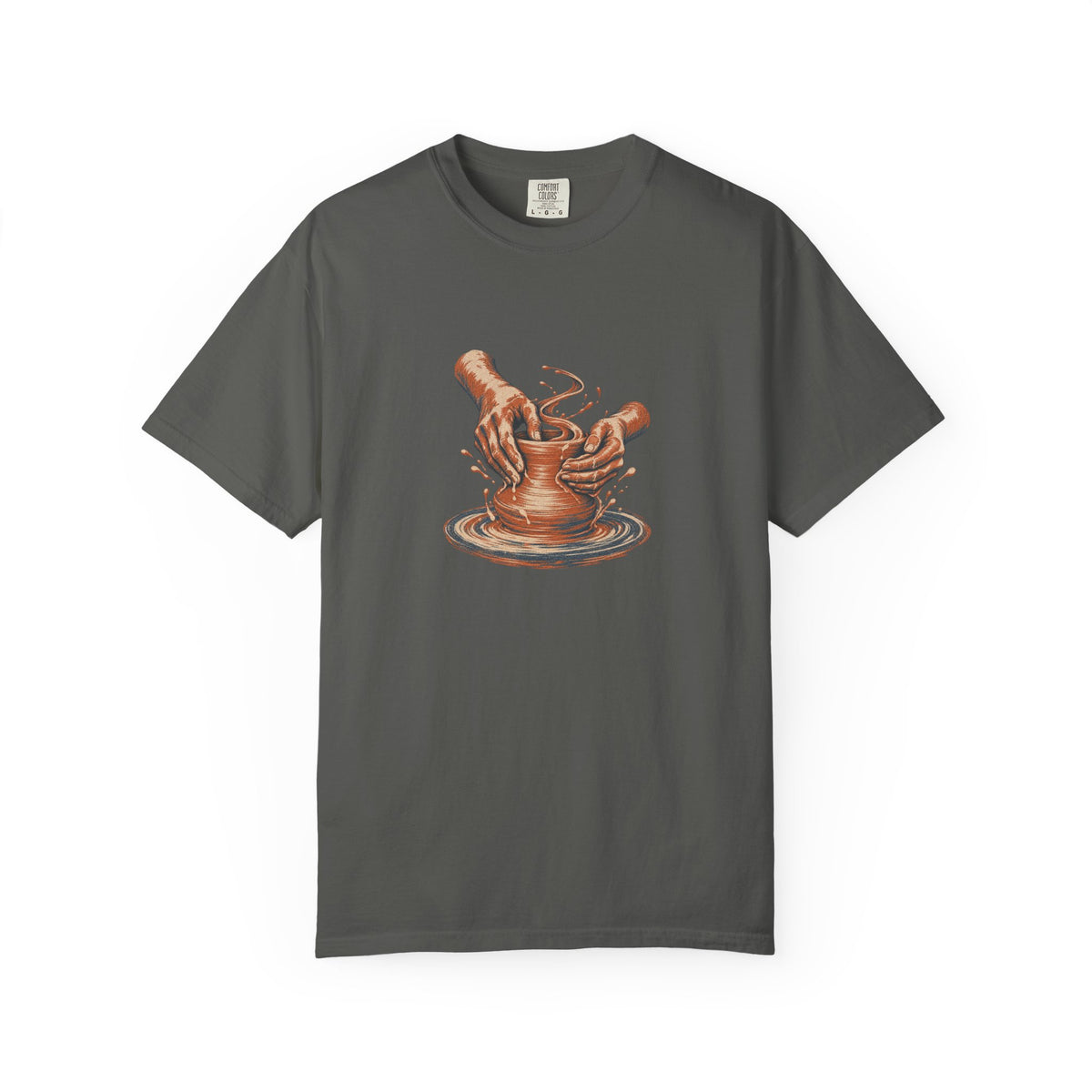 Pepper Comfort Colors 1717 t-shirt with cupped hands shaping clay on a pottery wheel, worn screenprint-style graphic